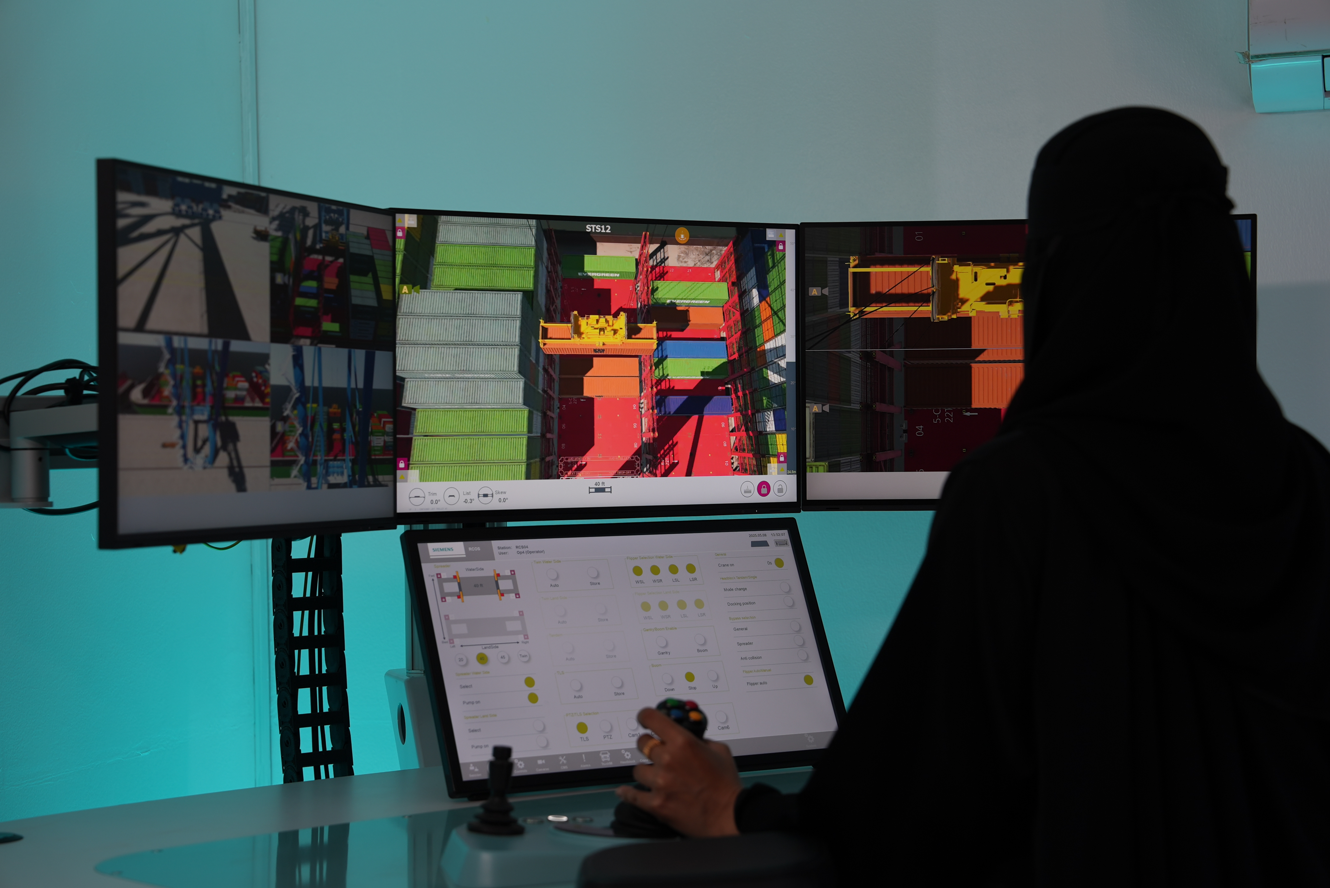 Photograph of a production specialist in the Port of NEOM control room
